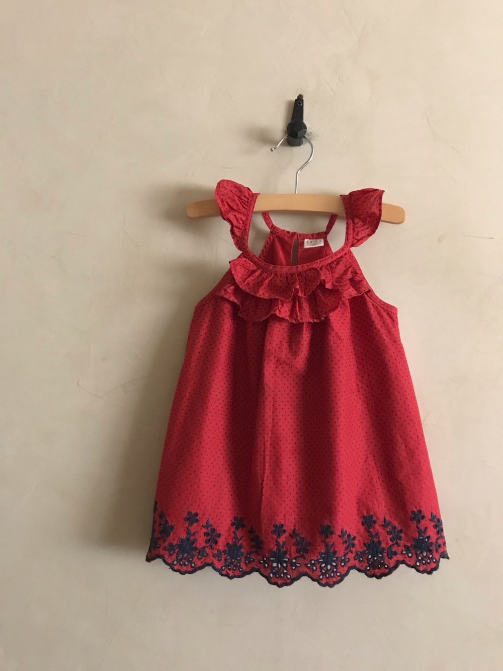 Red Ruffled Girl's Top with Embroidered Navy Hem